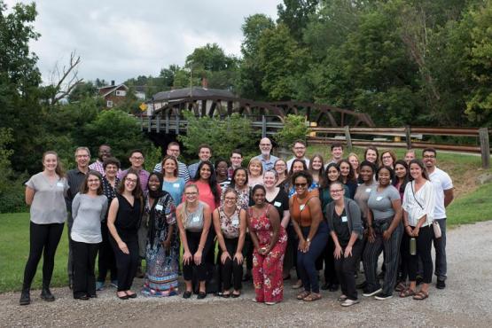 Group of RUSP students pose together outside