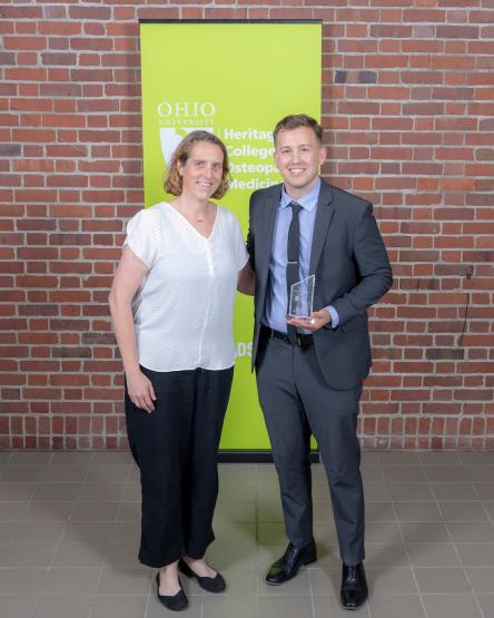 Student Cody Criss receives award during HCOM award ceremony
