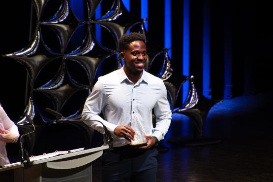 Student receives scholarship at award ceremony
