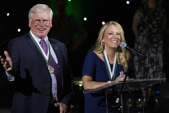 Jimmy and Robin Burrow provide remarks after being honored with the Phillips Medal at the Heritage College 50th anniversary gala.