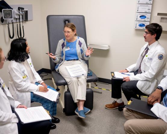 Medical students sit in a circle having a discussion in CTAC