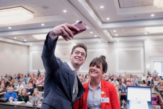 Doctor Mike poses for photo with physician at Ohio Osteopathic Symposium.