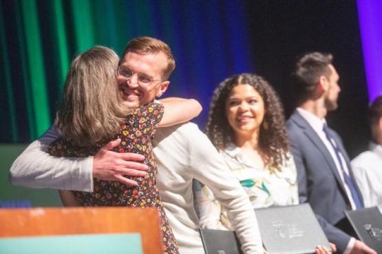 A photo of David Strawhun receiving a recognition award