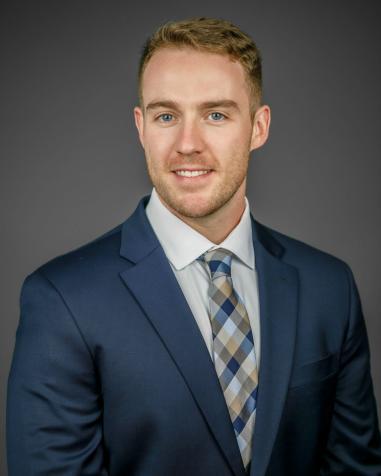 A headshot of Kyle McGrath