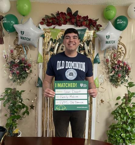 Sean Diment holding a match day sign
