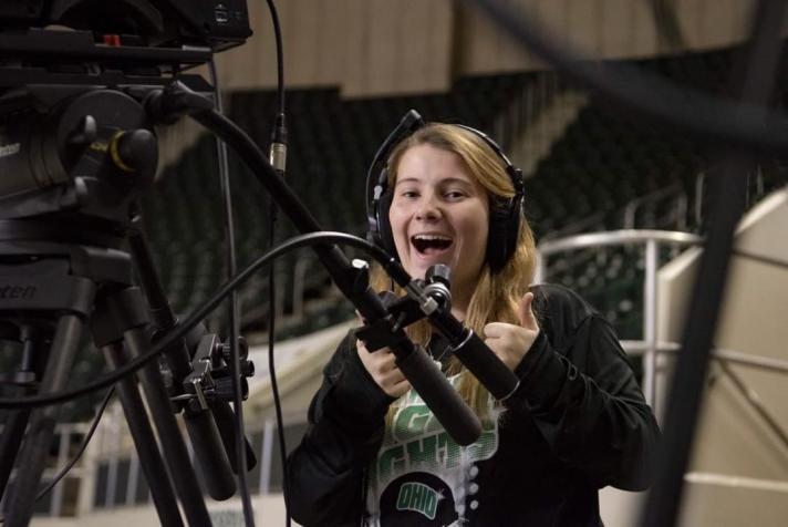 Student Claire Geary operates a video camera 