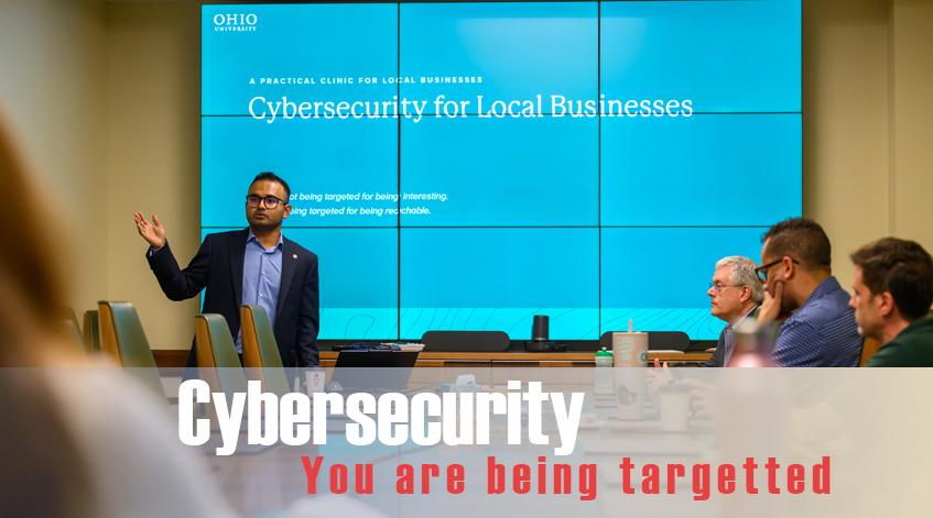 Dr. Das and Prof. Tong talking to local business about cybersecurity best practices.