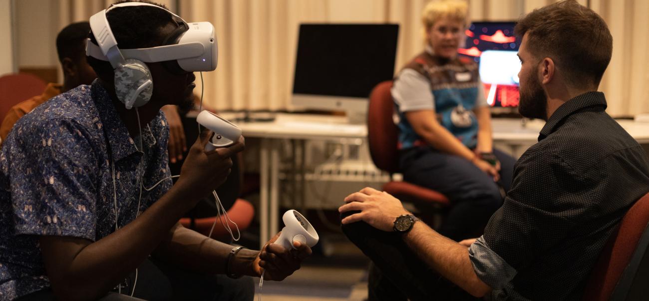 Students in a room using a VR headset
