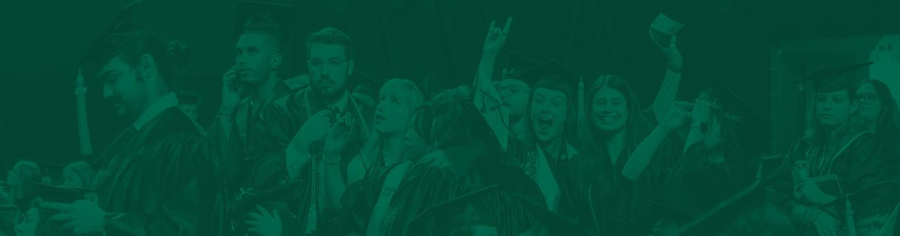 Students cheer at commencement.