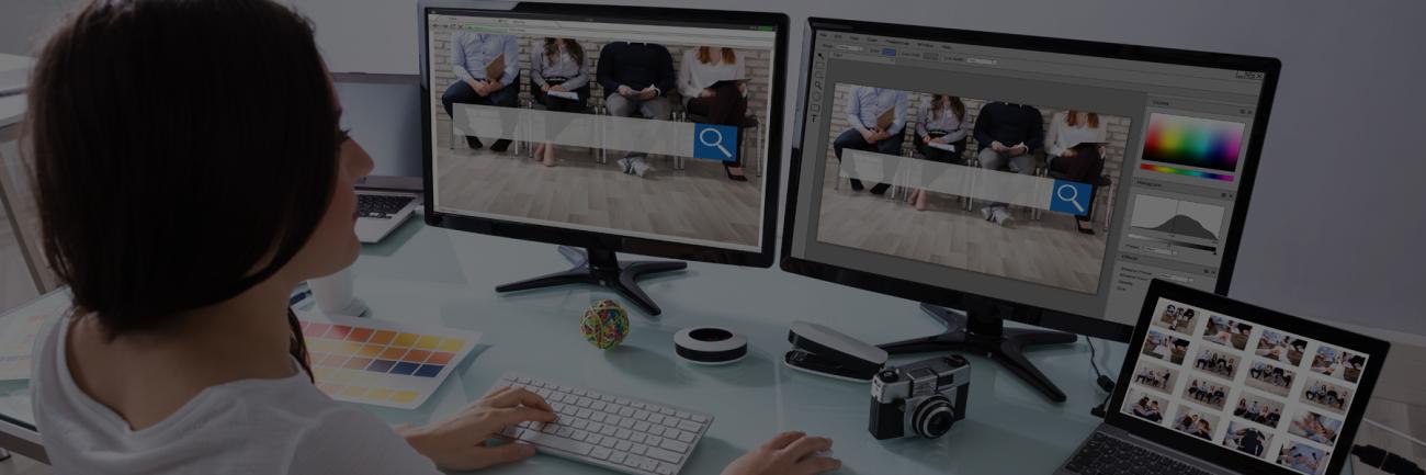 Woman working on design project on multiple screens