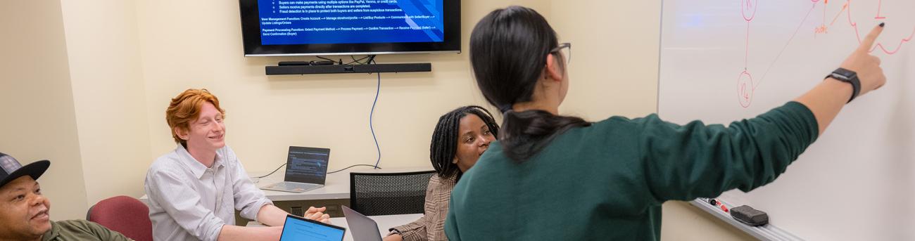 Students working in a group Internet Engineering networking project.