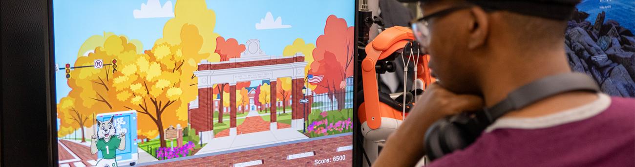 Student developing an OU based game with Rufus as a character.