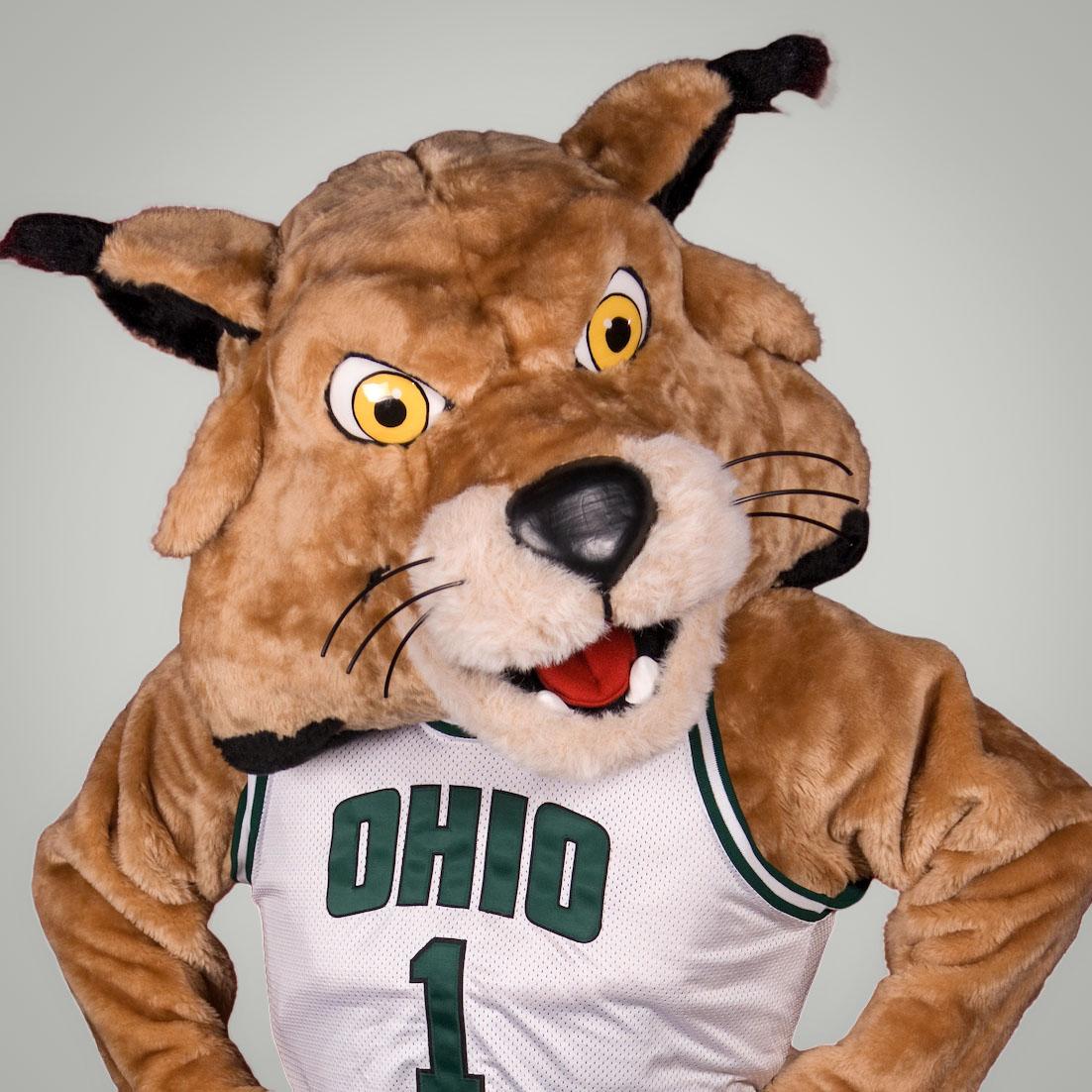 Rufus the Bobcat in and OHIO basketball jersey with the number 1 on it.