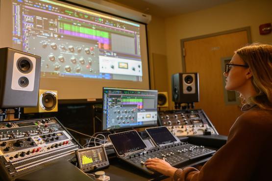 woman in the mixing and mastering studio