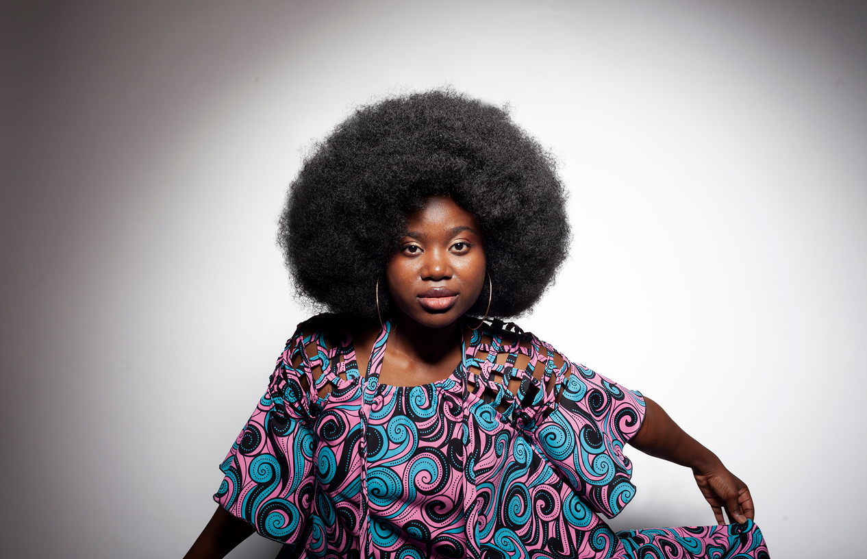 fashion photo of an African woman in a brightly colored dress