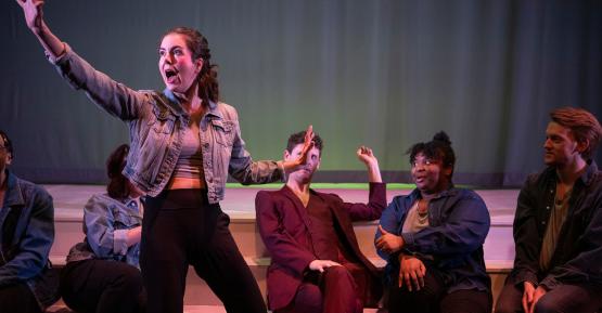 People acting on stage during a play