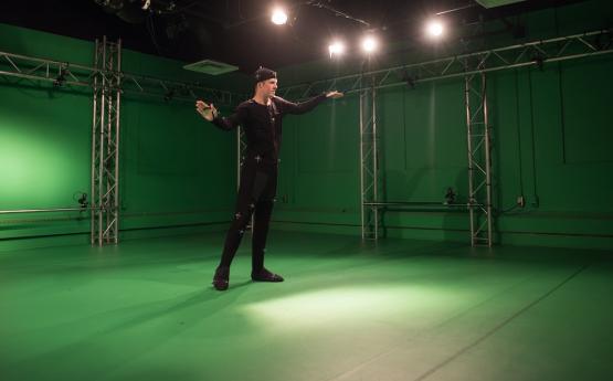 Student working in the motion capture room at the GRID Lab.