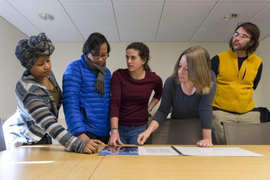 group of people reviewing a document together