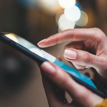 Hands holding a mobile phone