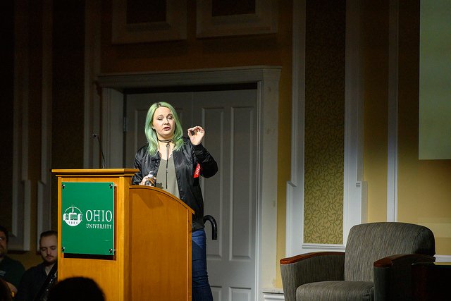 Tara Voelker speaking from the podium at the Business of Games Summit