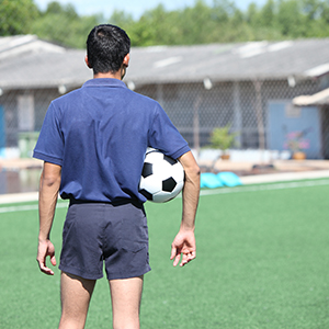 Soccer referee holding ball