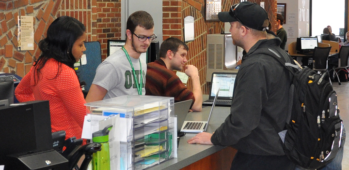 Students working at a resource desk