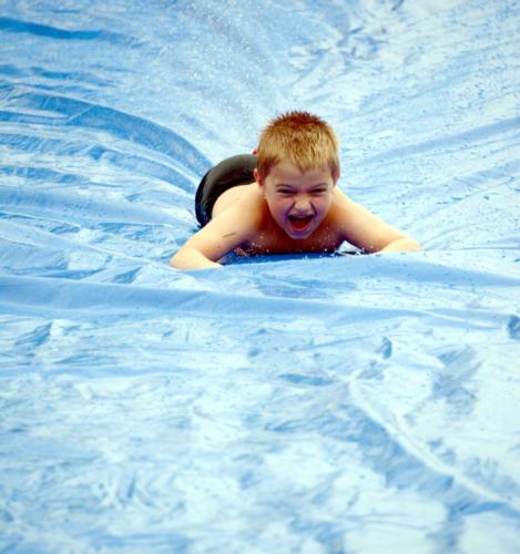 Child on water slide