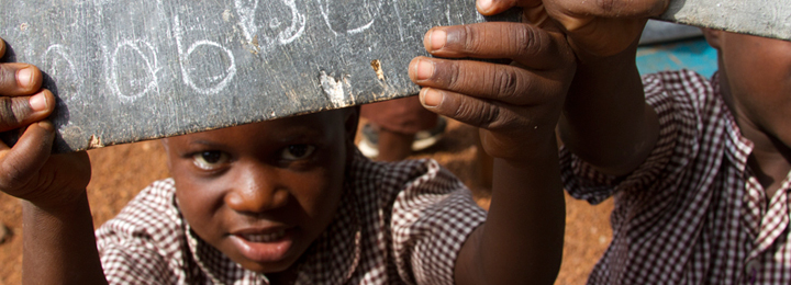 Ghanian child with a chalkboard
