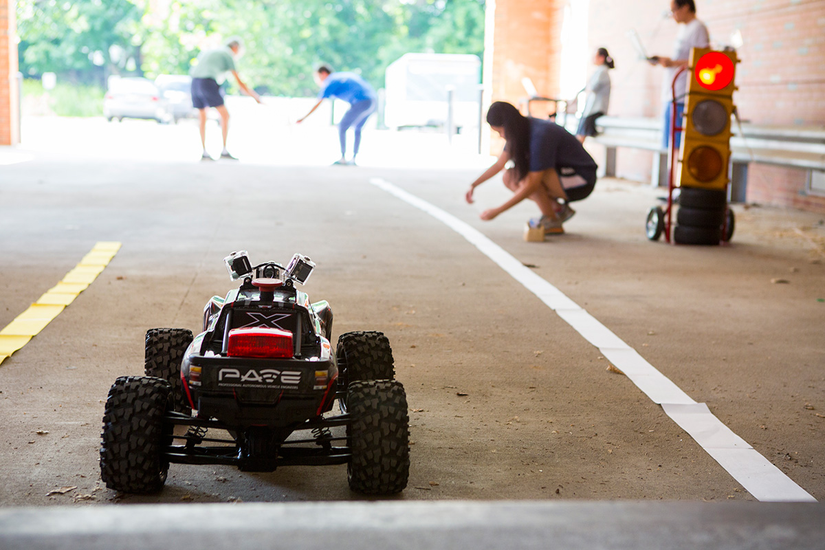 student team testing technology in a small car