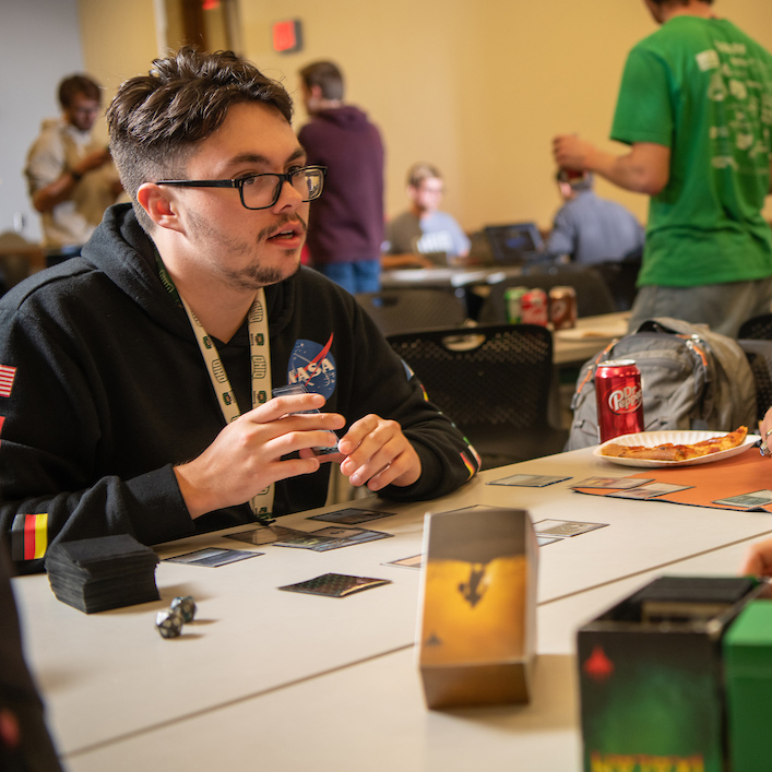 Students play Magic: The Gathering during an Esports tournament.