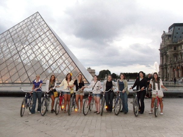 Ohio University students studying away in Germany pose at the Louvre Pyramid.