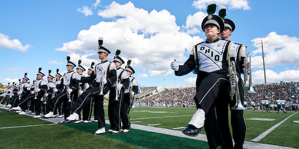 Marching 110 members march on the football field