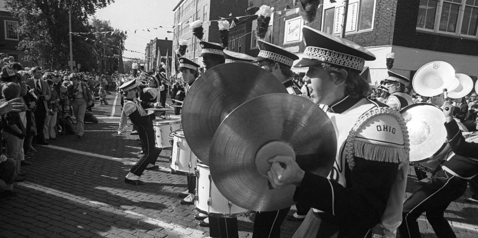 Ohio University Marching 110 band drumline in Court and Union intersection during homecoming parade in 1980.