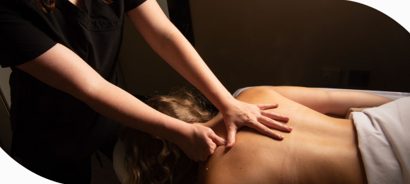 Massage Therapist performing 60 minute massage