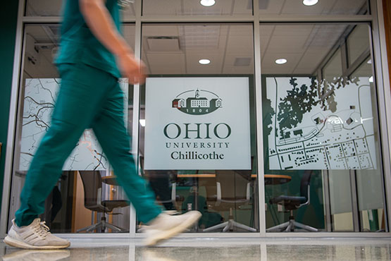 Student walks past office on Chillicothe campus