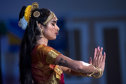 Student dances on stage in a Multicultural Center event