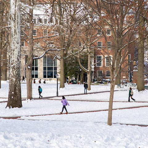 Ohio University students walk through a snowy campus