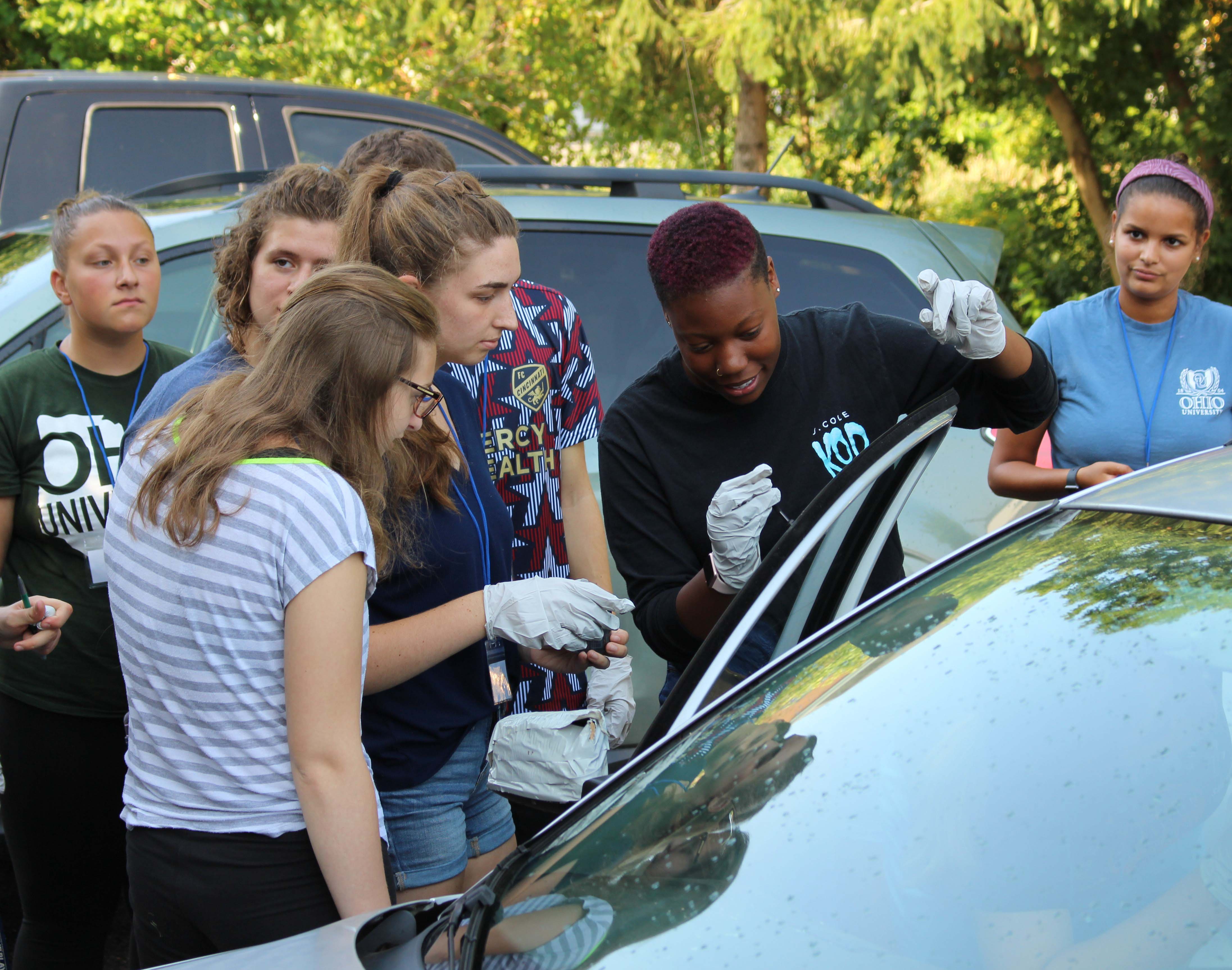 Students around a car