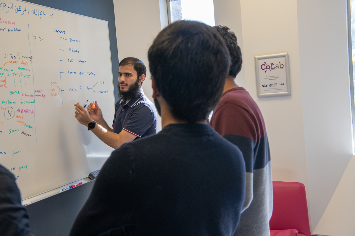 People at a white board