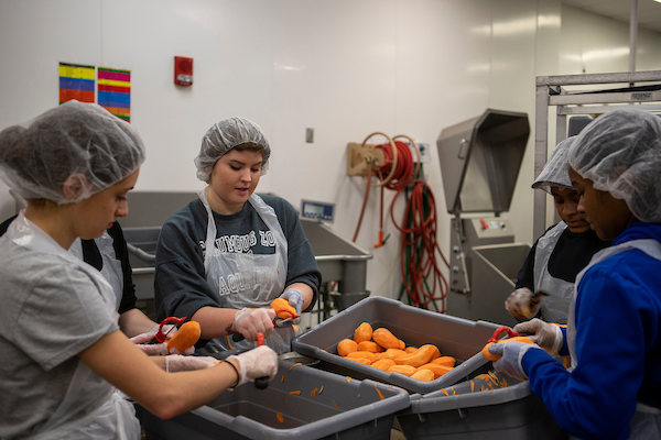 Central Food Facility employees work together to prepare food for OHIO dining locations