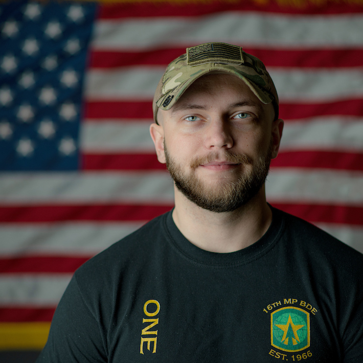 Headshot of an Ohio University veteran with a United States flag in the background
