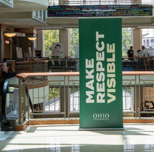 A banner hangs in Baker University Center that reads "make respect visible"
