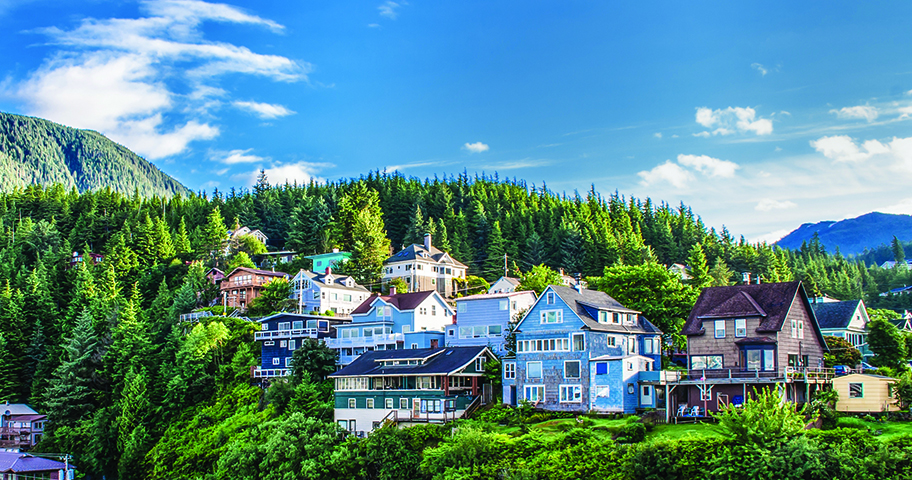 City of Ketchikan, lush green landscape with colorful houses.