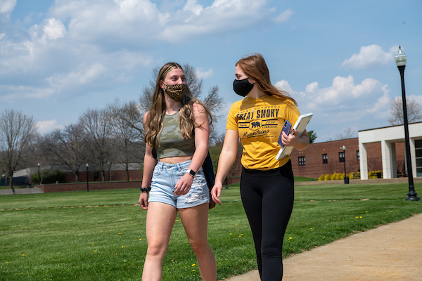Two students walking in campus
