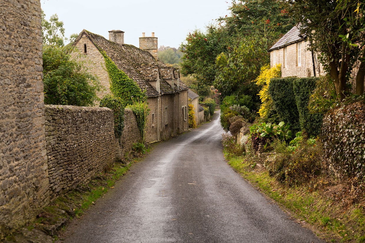 Road traveling through village of Minster Lovell in England.