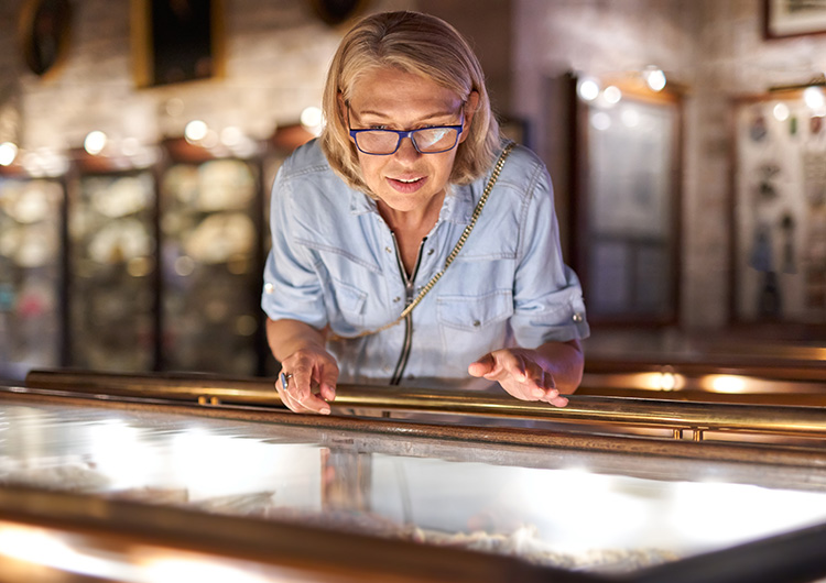 A woman looking into a display case
