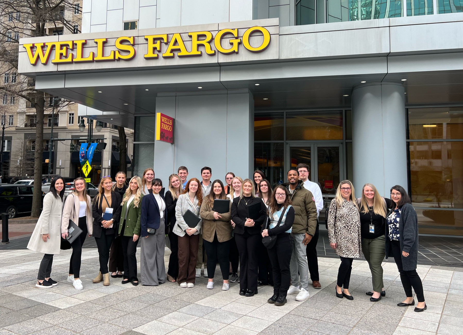 Society For Human Resource Management group standing in front of Wells Fargo