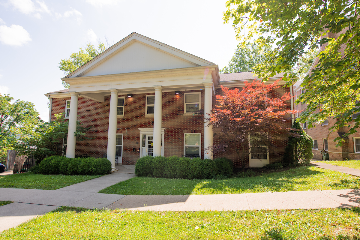 Exterior of 4 University Terrace building, featuring bricks and white columns
