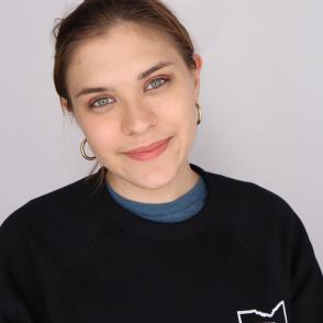 Student smiles for a professional portrait