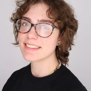 Student smiles for a professional portrait